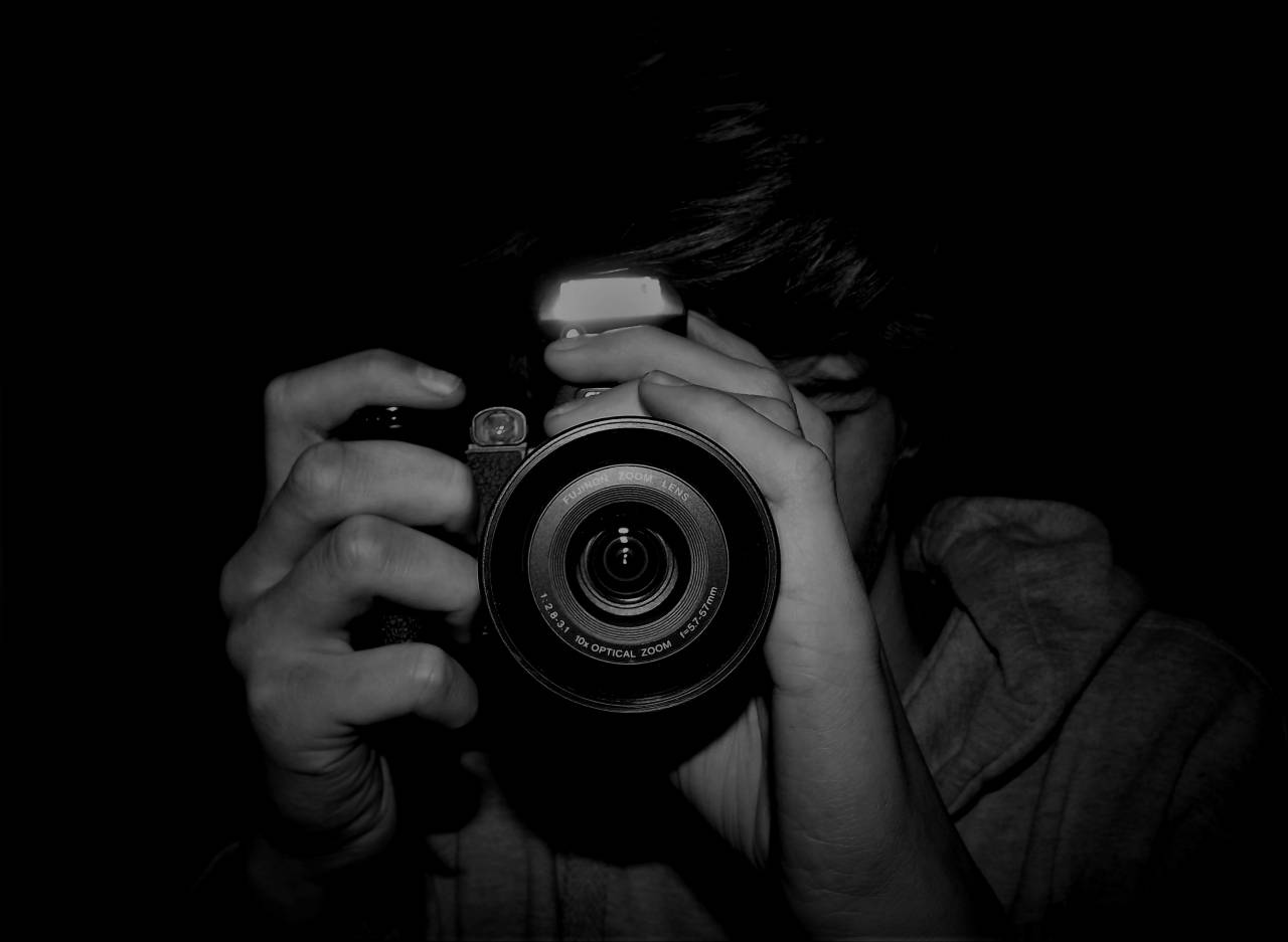   man  cameras optics  single lens reflex  — free black and white photo