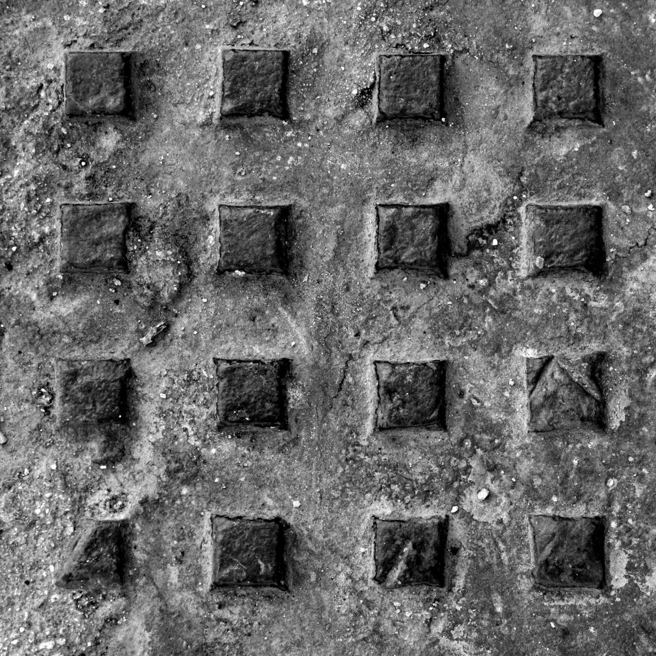 Rusted Metal Manhole Cover Texture   Free  — free black and white photo
