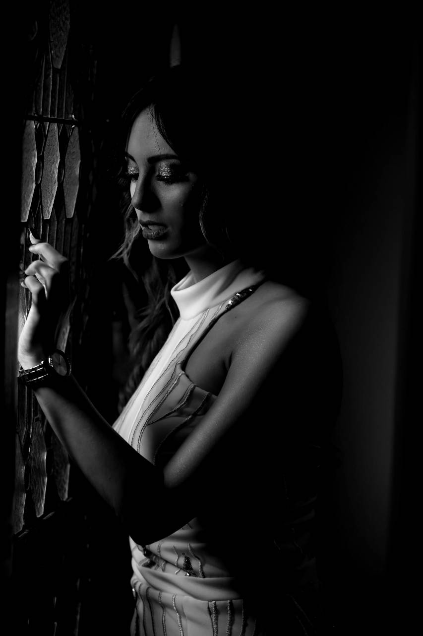 woman window stained glass pretty looking attractive brunette  — free black and white photo