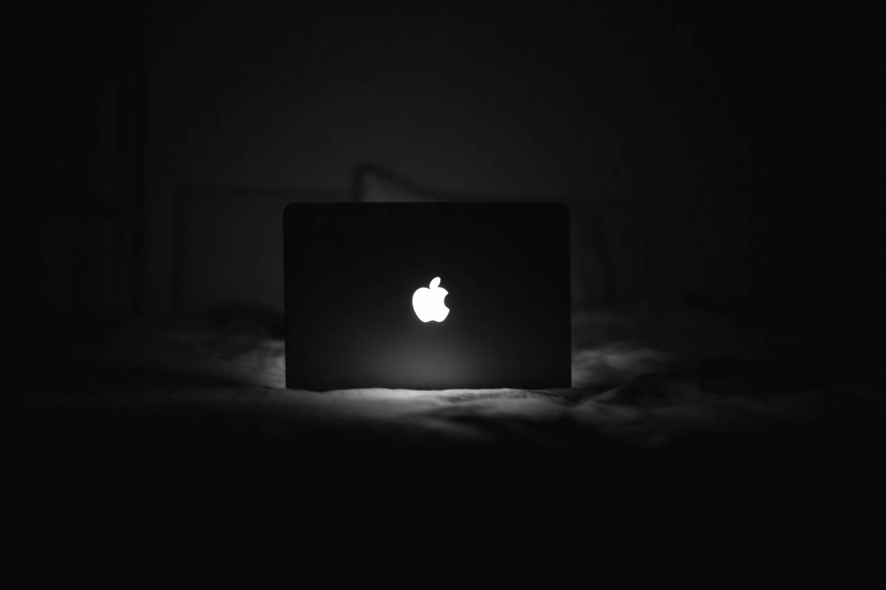 B&W MacBook Glowing Apple Logo Free Stock Photo  — free black and white photo