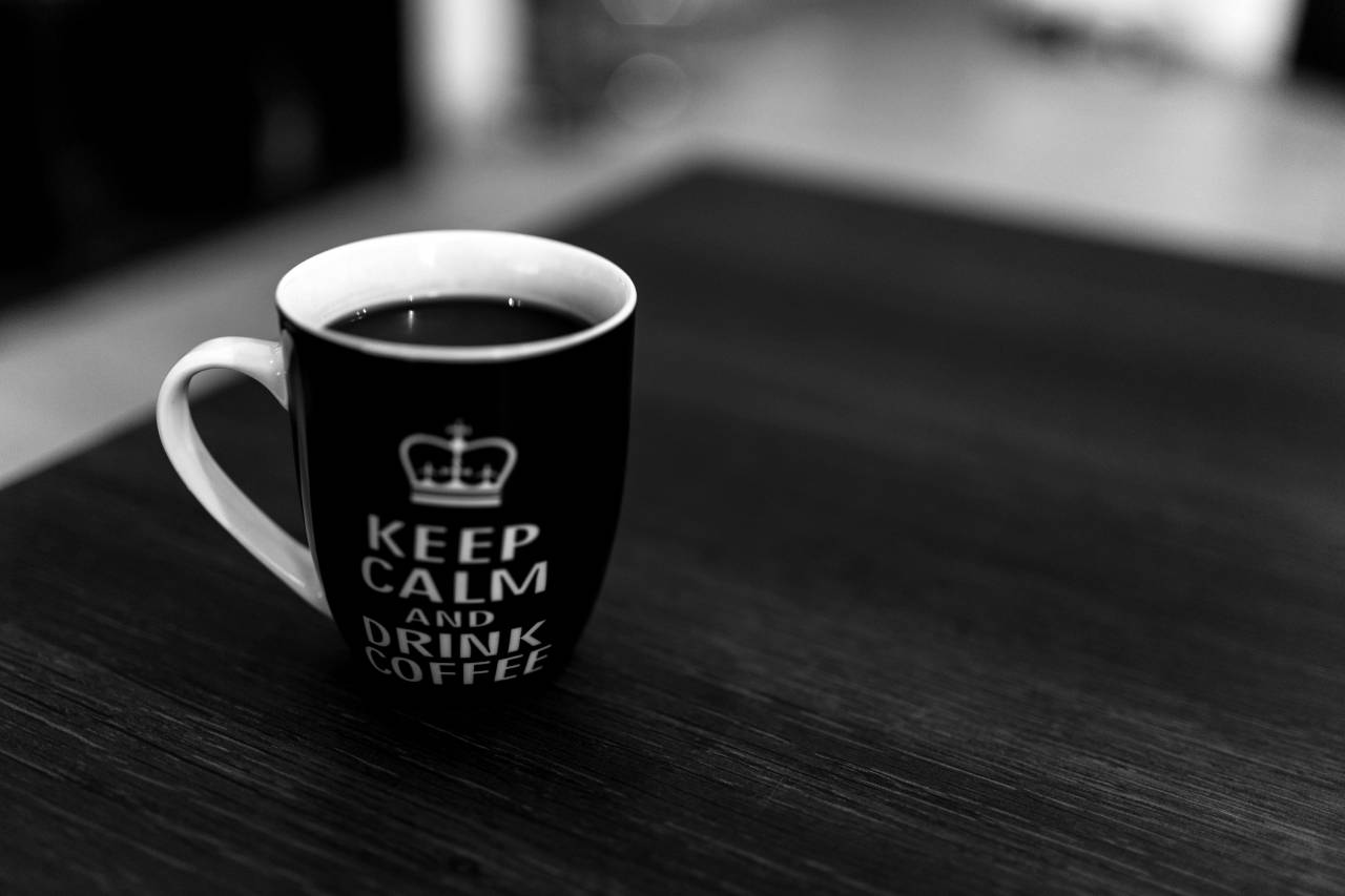 Black & White Coffee Mug on Desk Free Stock Photo  — free black and white photo