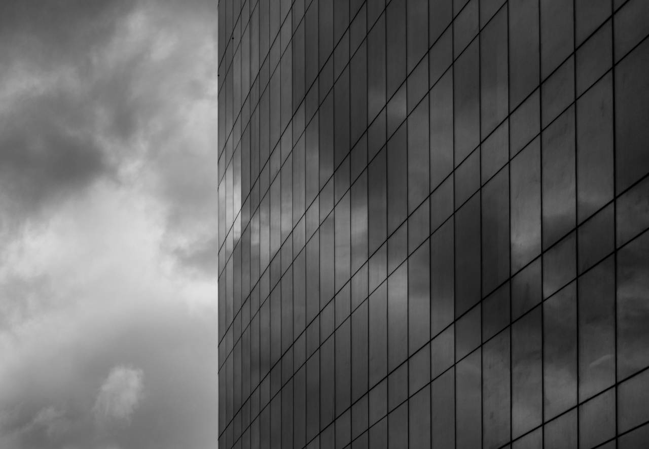 Clouds Reflecting on Skyscraper Free Stock Photo  — free black and white photo