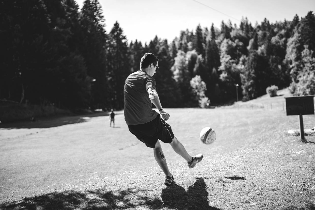 Kicking Soccer Ball Free Stock Photo - NegativeSpace — free black and white photo