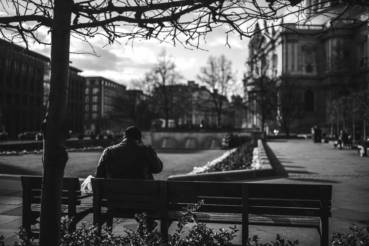 Man Sitting on Bench at Park Free Stock Photo - NegativeSpace — free black and white photo
