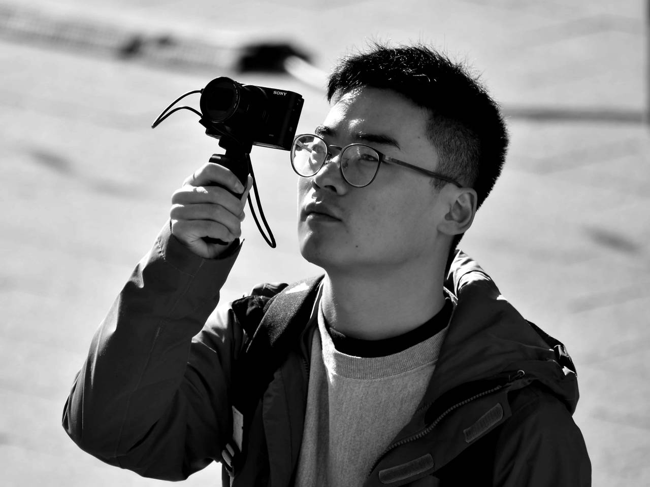 businessman photographer camera china face tourist attraction portrait — free black and white photo