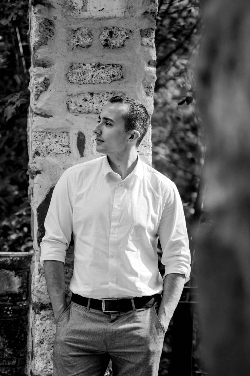 casual standing shirt outdoors portrait person wood summer  — free black and white photo