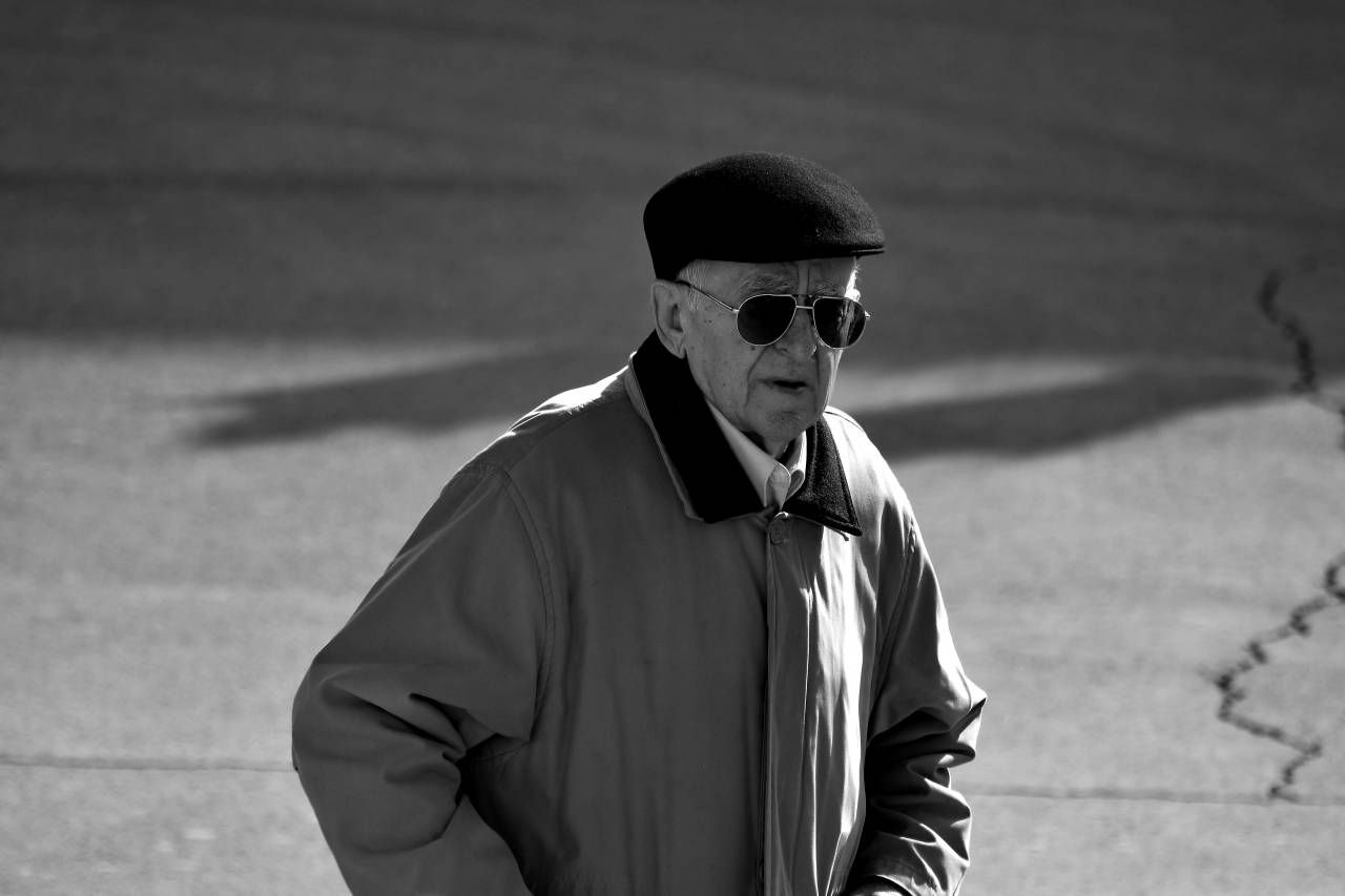 grandfather serious confidence person businessman jacket sunglasses street  — free black and white photo