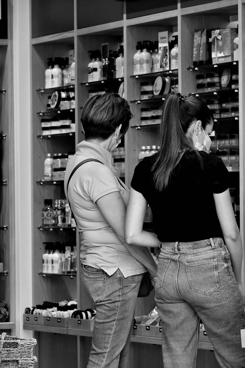 social distance face mask shopping customer indoors counter shelf woman — free black and white photo