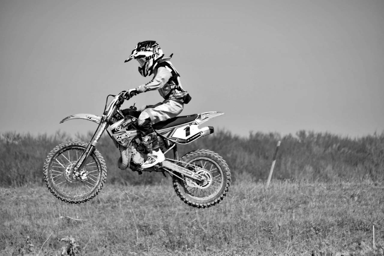 danger jump extreme adventure motorcyclist motorcycle motocross contest helmet  — free black and white photo