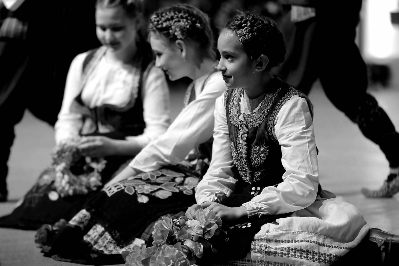 folk sitting costume traditional dancing festival outfit child  — free black and white photo