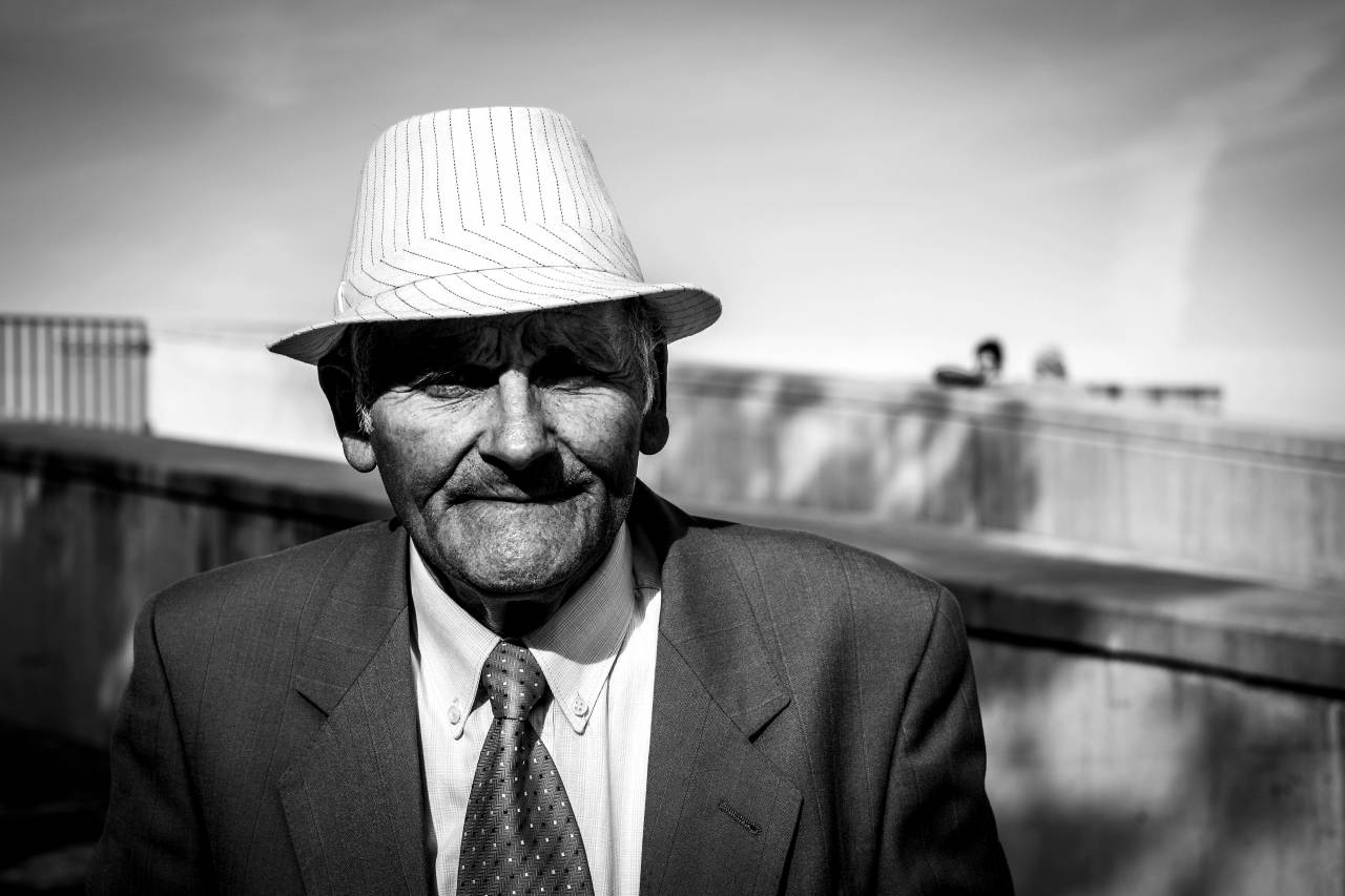   man  suit  black and white  people  street  — free black and white photo