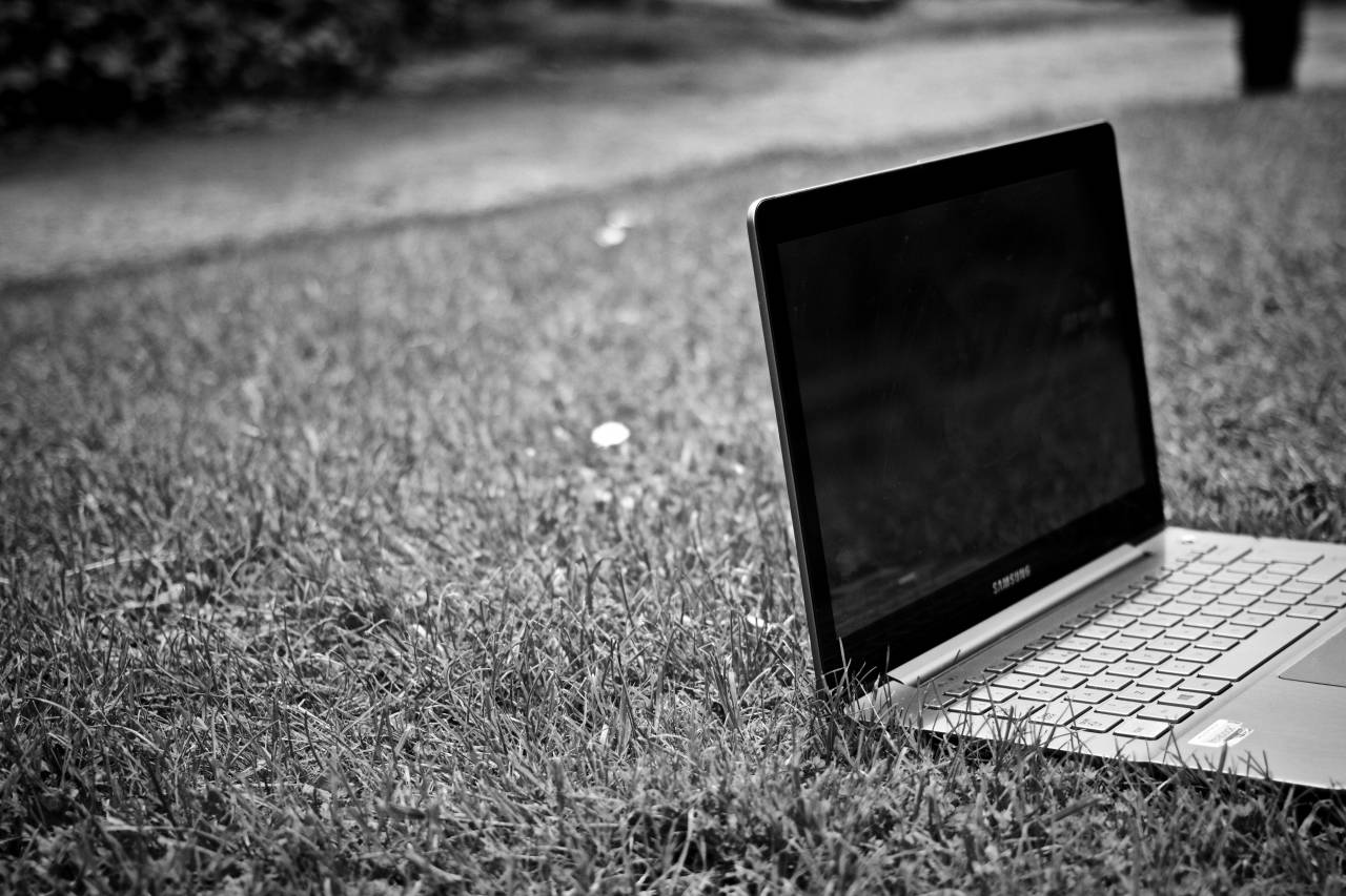 Laptop Computer on Grass Free Stock ?Photo? -  — free black and white photo