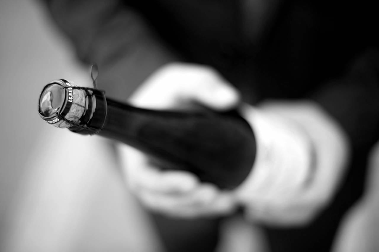 Man Holding Champagne Wine  — free black and white photo