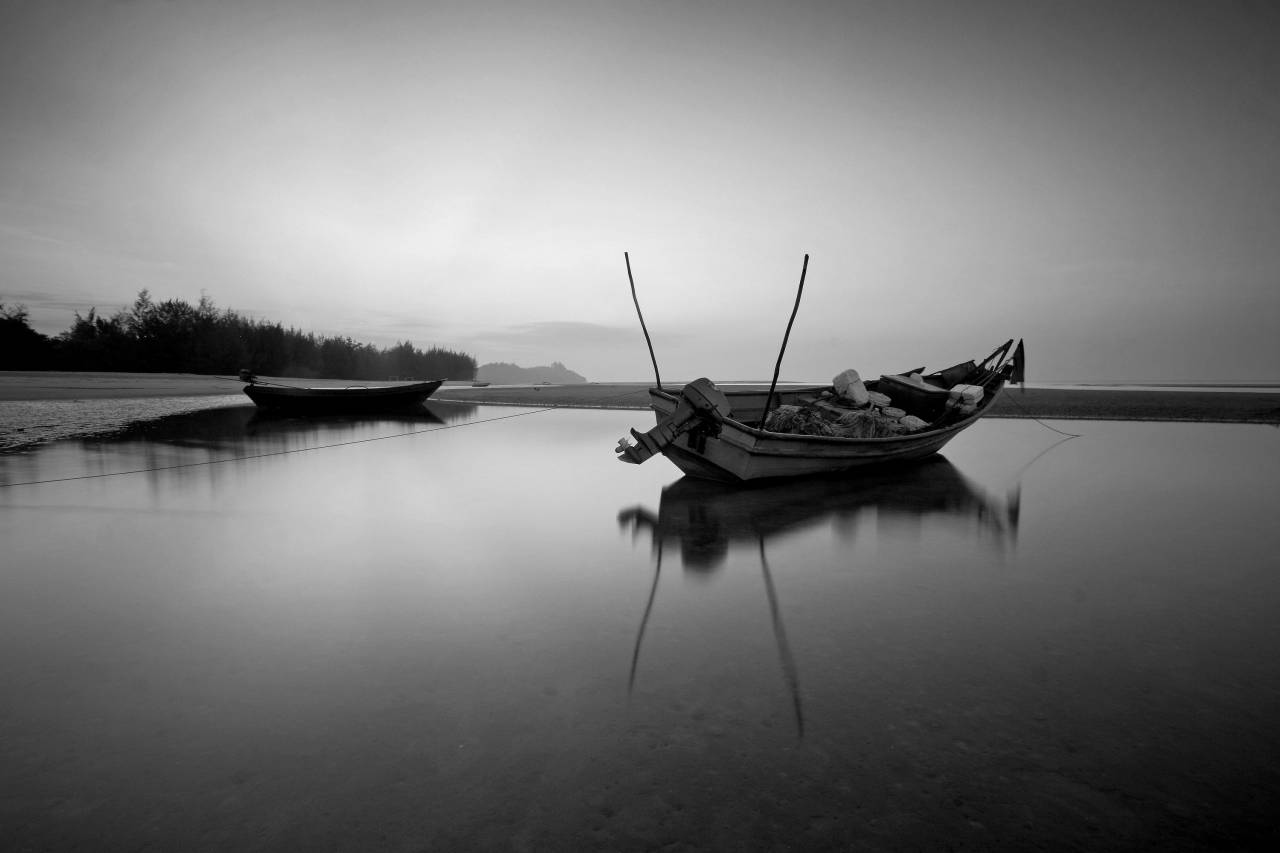 Fishing Boat in Still Water  — free black and white photo