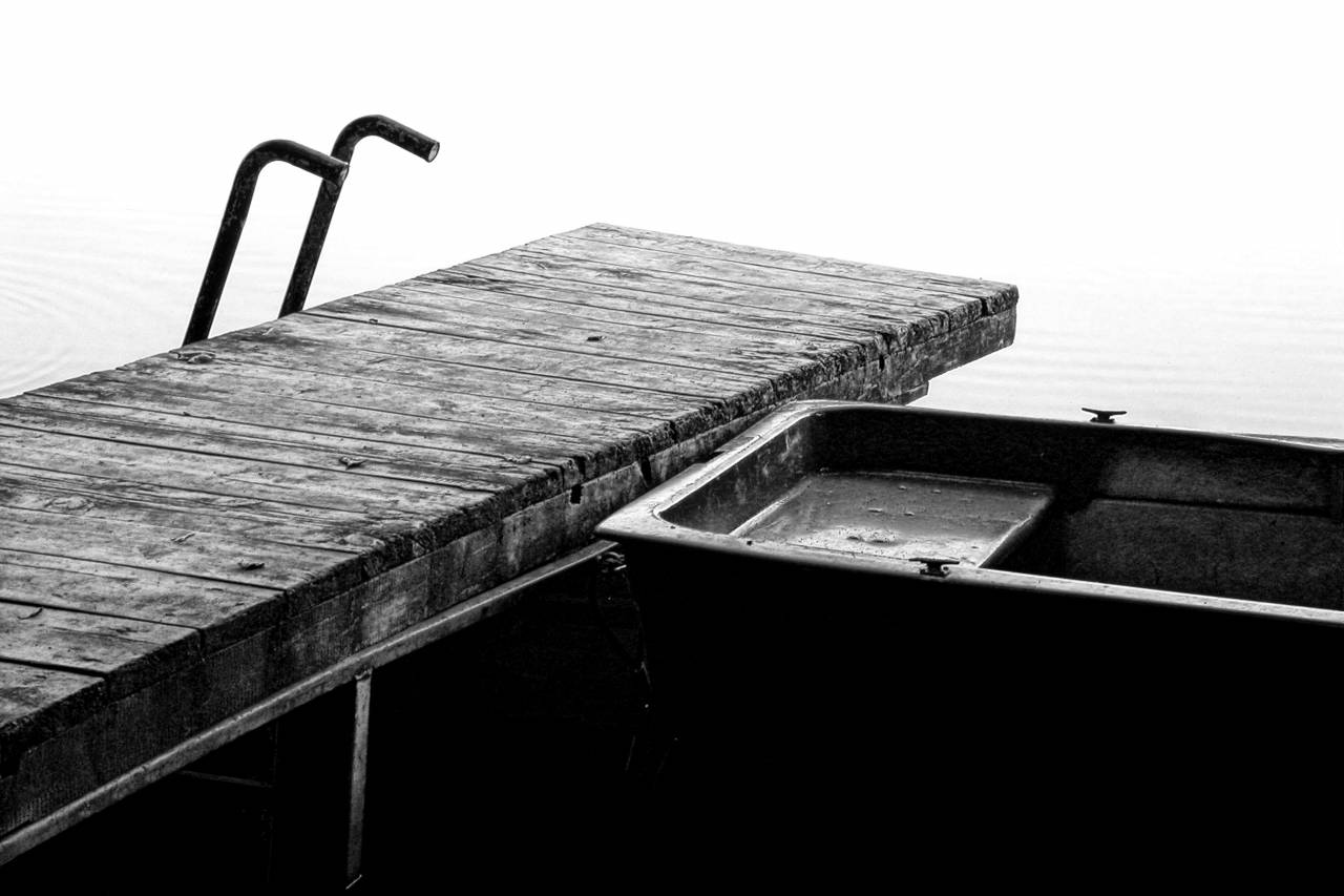 floating deck dock boat horizon water ocean lake transportation vehicle  — free black and white photo