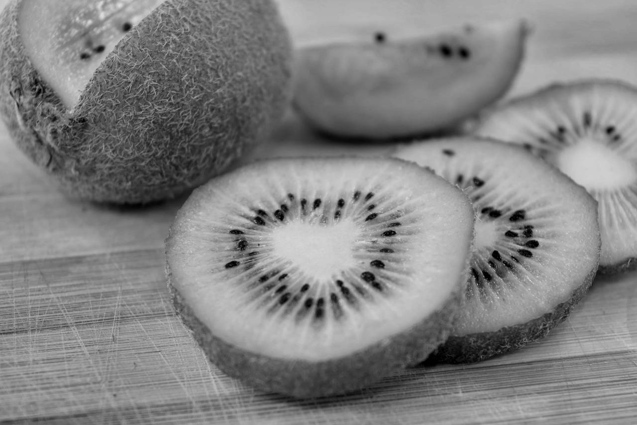 fruit kiwi bitter slices tropical healthy fresh tasty vitamin diet fruits  — free black and white photo