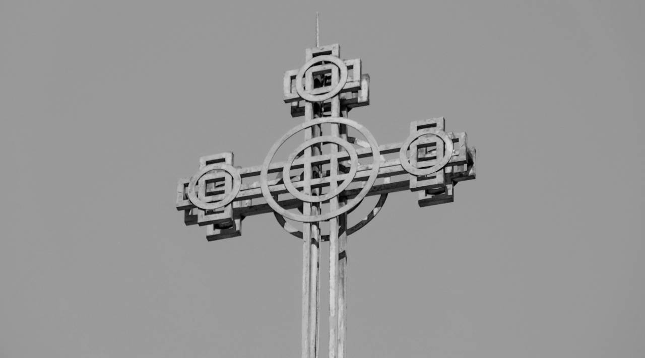 orthodox iron cross yellow steel outdoors architecture traditional — free black and white photo