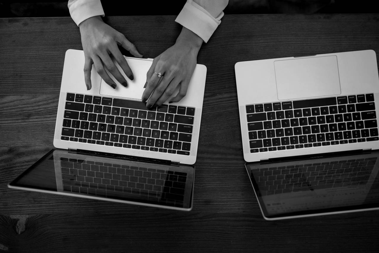 Woman Typing  — free black and white photo