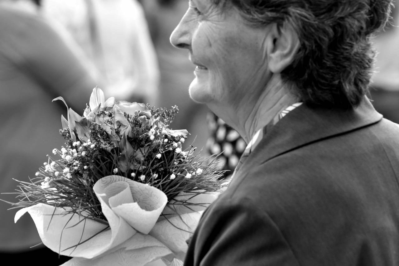 businesswoman granny bouquet pensioner businessperson ceremony arrangement decoration flowers woman — free black and white photo