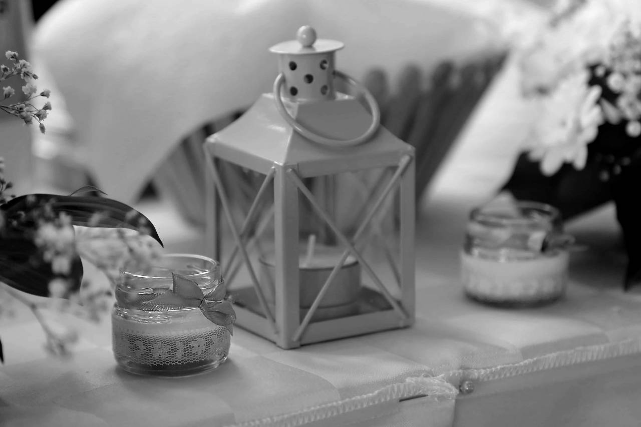 candle wedding indoors flower lantern candlestick decorative table tablecloth still — free black and white photo