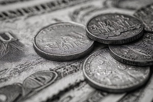 abstract composition of coins and paper money macro detail fo — black and white photo