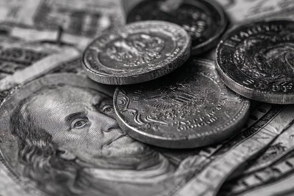 abstract composition of coins and paper money macro detail fo — black and white photo