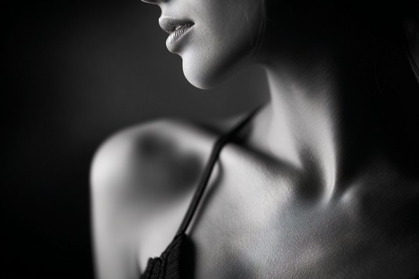 black and white boudoir picture close up of womans shoulder a — black and white photo