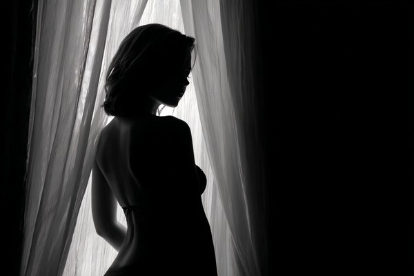black and white boudoir picture female silhouette standing ne — black and white photo