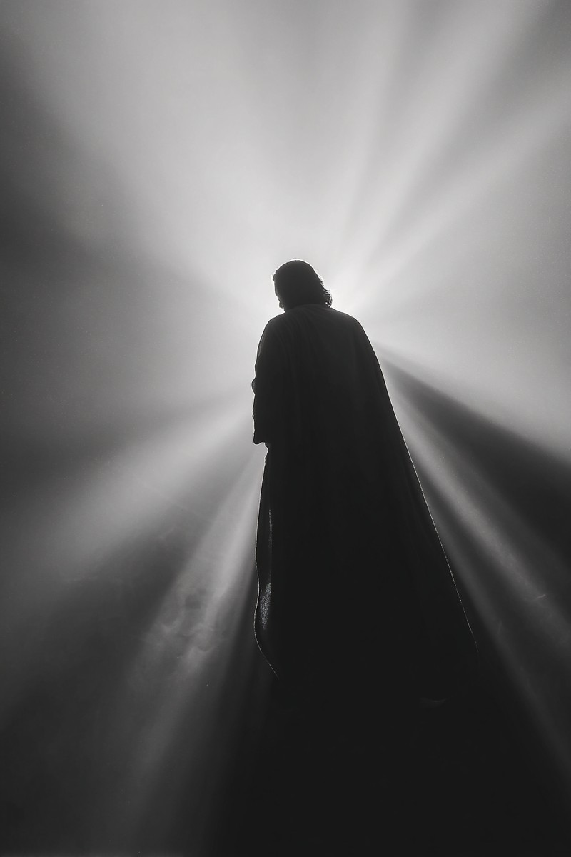 black and white picture of jesus standing silhouette with sof — free black and white photo