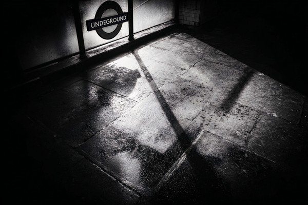 black and white picture of london london underground entrance — black and white city photo