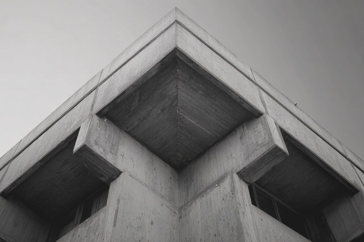 brutalist concrete architecture strong geometric shapes and h — free black and white photo