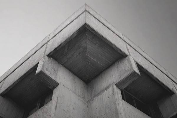 brutalist concrete architecture strong geometric shapes and h — black and white city photo