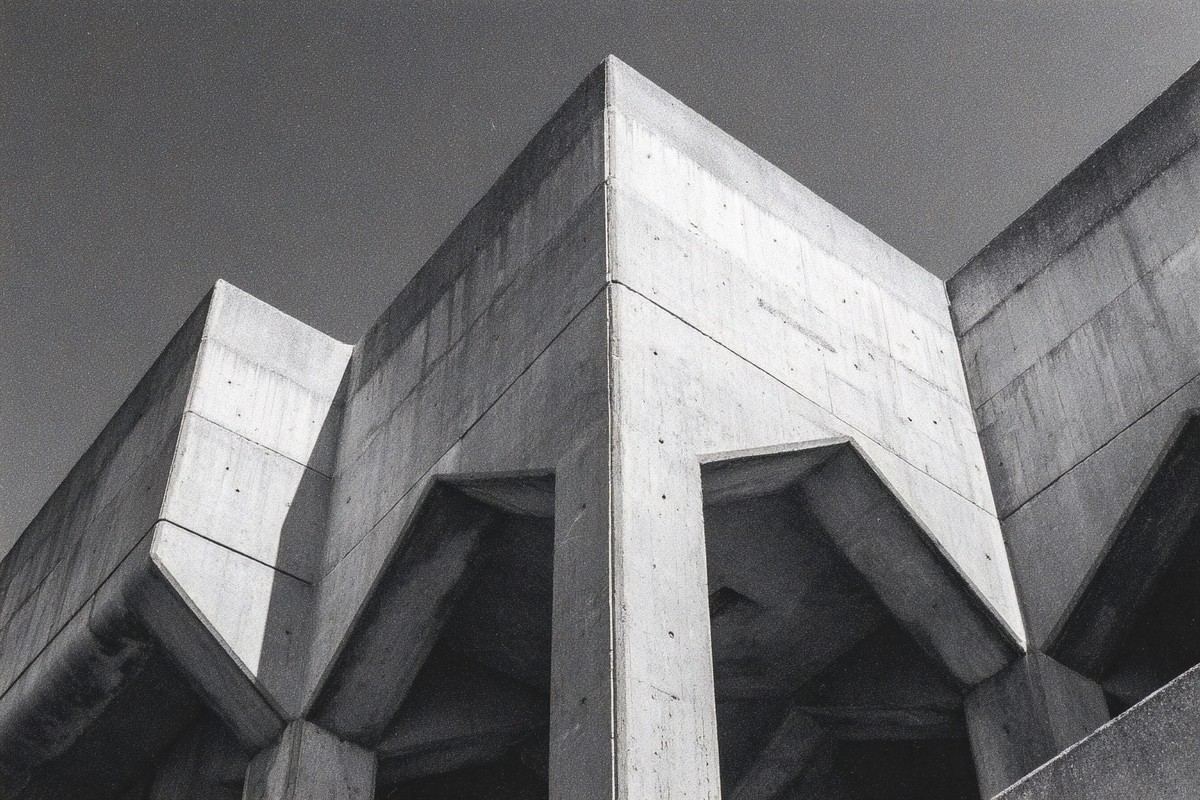 brutalist concrete architecture strong geometric shapes and h — free black and white photo