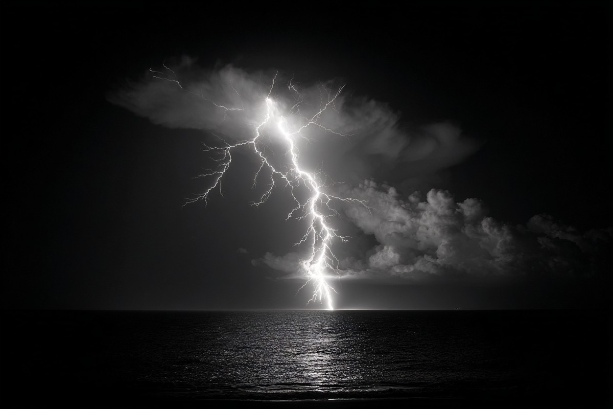 fine art photograph of a lightning bolt striking over a dark — free black and white photo