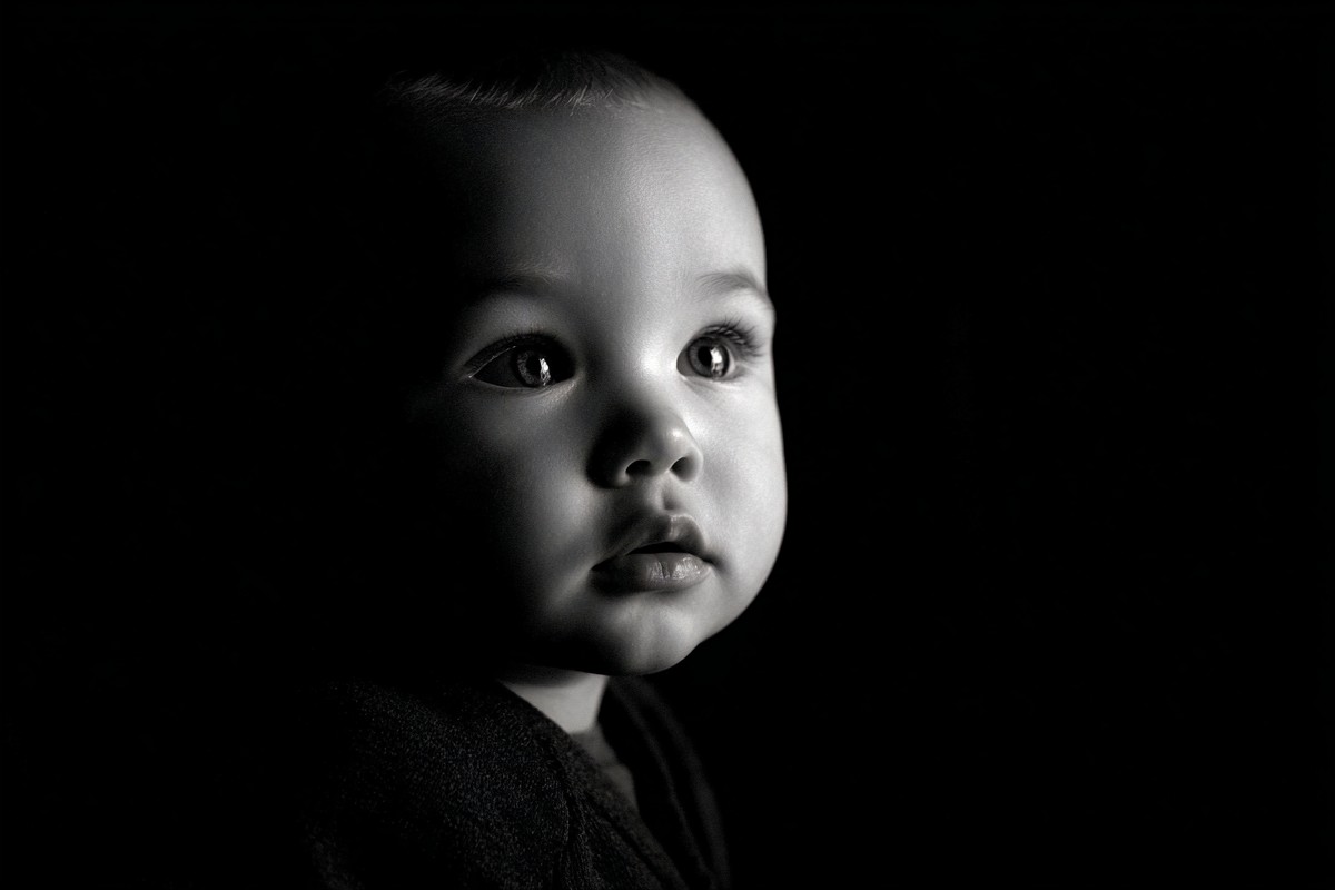 infant black and white picture low key studio lighting dramat — free black and white photo