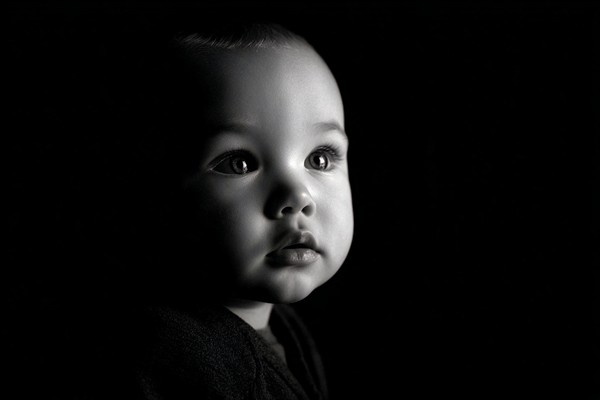 infant black and white picture low key studio lighting dramat — black and white photo