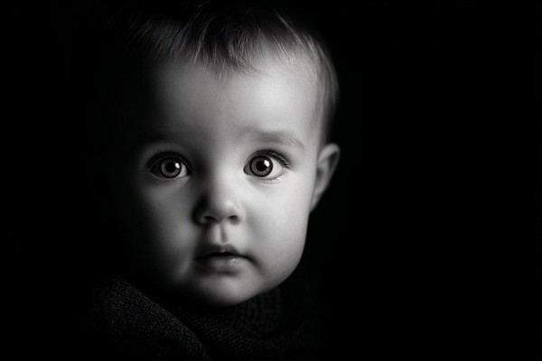 infant black and white picture low key studio lighting dramat — black and white photo