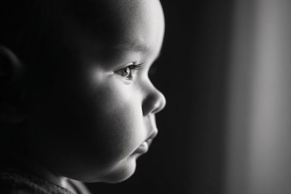 infant black and white picture soft window light from the sid — black and white photo