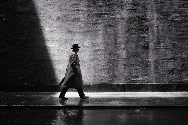 silhouettes fine art street photography a lone figure in a tr — black and white photo
