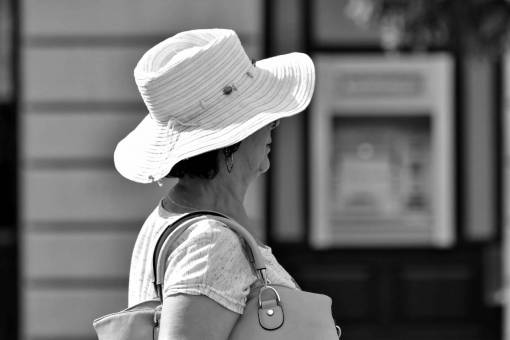 side portrait clothing woman hat street pensioner outdoors person pretty  veil scarf gorgeous — black and white photo