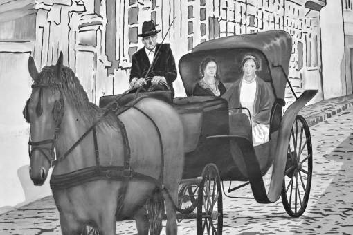 graffiti elderly cavalry carriage outdoors member horse  — black and white photo