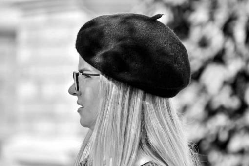 side french pretty blonde hat woman portrait outdoors  — black and white photo