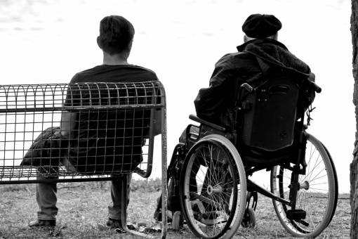 wheelchair elderberry furniture outdoors togetherness bench seat als veterans justice  — black and white photo