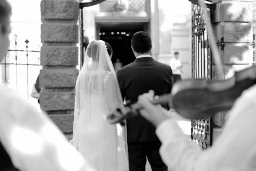groom violin bride woman man veil ceremony wedding — black and white photo