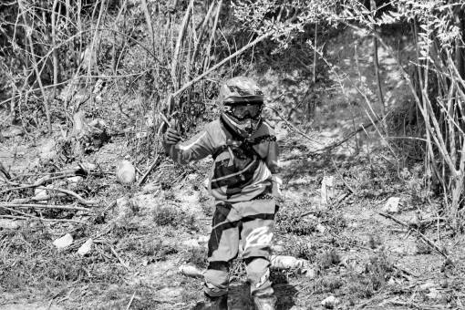 outdoors enthusiasm motorcyclist dirty person danger helmet adventure nature wood — black and white photo
