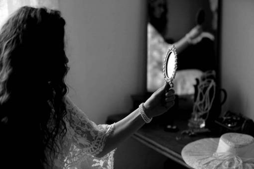 hand hairstyle brunette hat mirror bride bracelet pearl jewelry — black and white photo